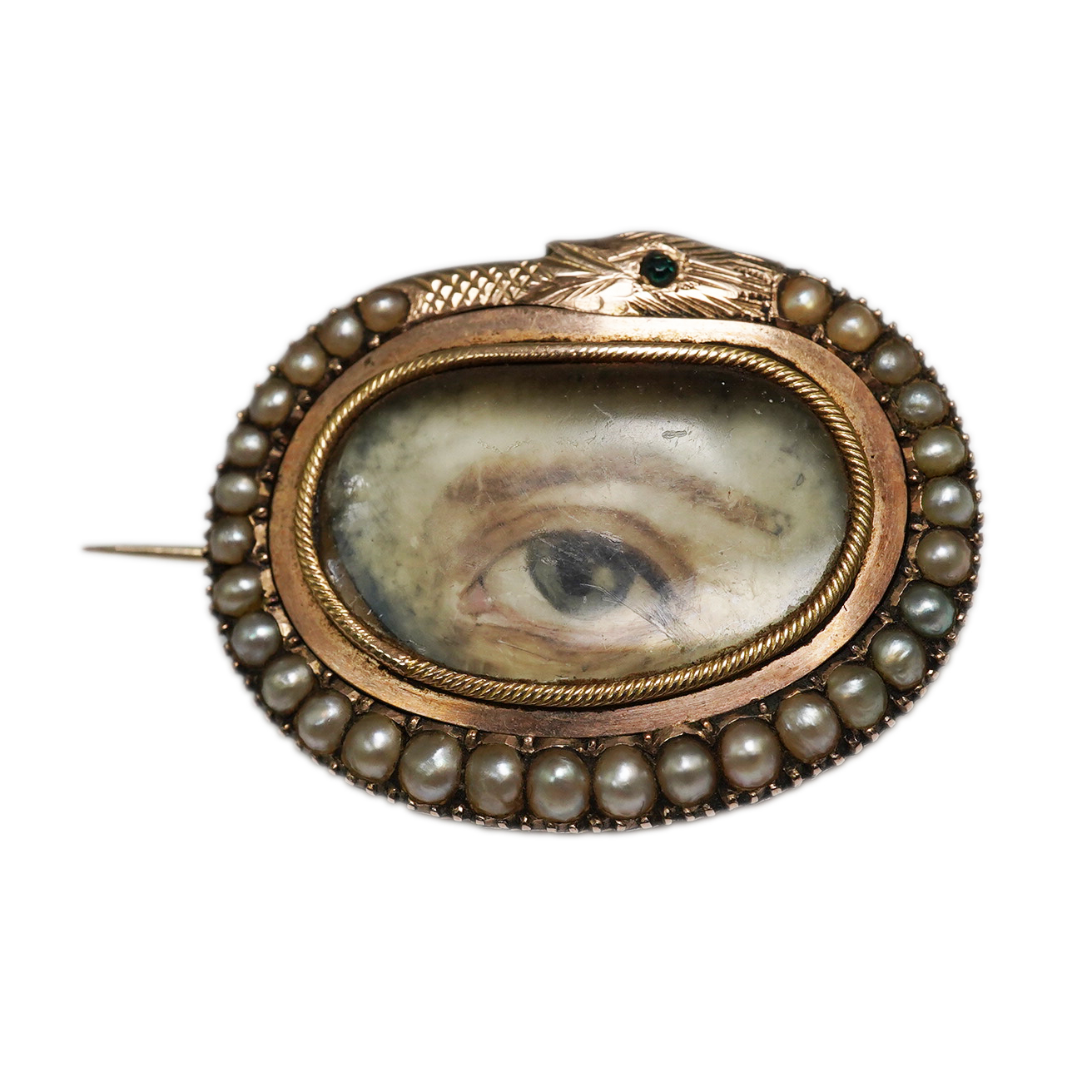 A Regency gold and split pearl mounted oval pendant brooch with inset 'lover's eye' miniature